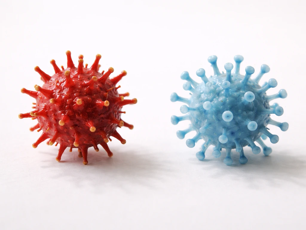 Two side-by-side abstract virus icons with distinct shapes on a clean light background.